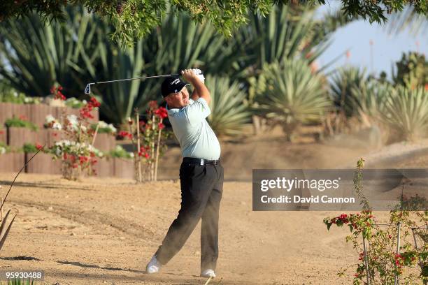 Damien McGrane of Ireland play his second shot from wasteland at the par 4, 6th hole during the second round of The Abu Dhabi Golf Championship at...