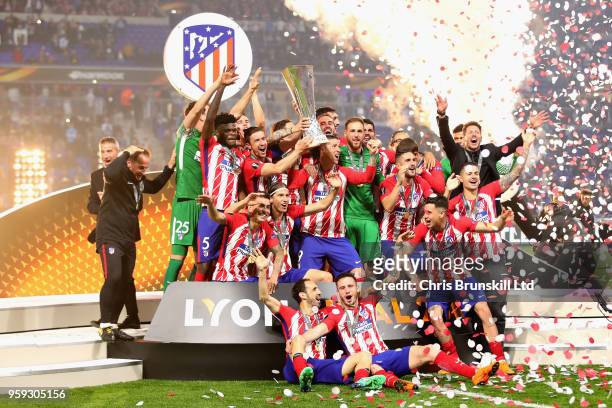 Gabi of Club Atletico de Madrid and his team lift the trophy after winning during the UEFA Europa League Final between Olympique de Marseille and...