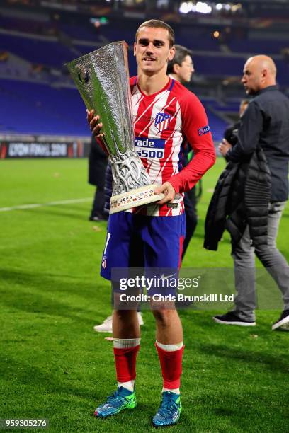 Antoine Griezmann of Club Atletico de Madrid celebrates with the trophy after winning the UEFA Europa League Final between Olympique de Marseille and...
