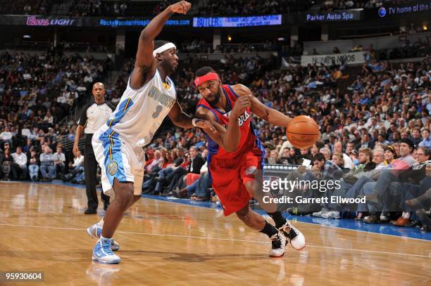 Baron Davis of the Los Angeles Clippers goes to the basket against Ty Lawson of the Denver Nuggets on January 21, 2010 at the Pepsi Center in Denver,...