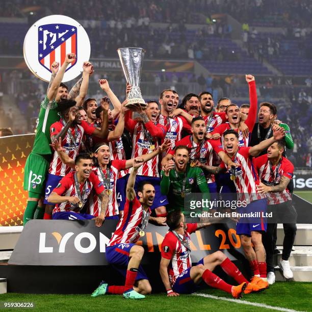 Gabi of Club Atletico de Madrid and his team lift the trophy after winning during the UEFA Europa League Final between Olympique de Marseille and...
