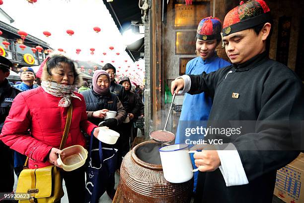 Free Laba porridge is handed out on January 22, 2010 in Hangzhou, Zhejiang province of China. The traditional Laba Festival falls on the 8th day of...