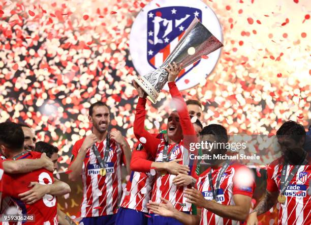 Antoine Griezmann of Atletico Madrid celebrates with the trophy following the UEFA Europa League Final between Olympique de Marseille and Club...