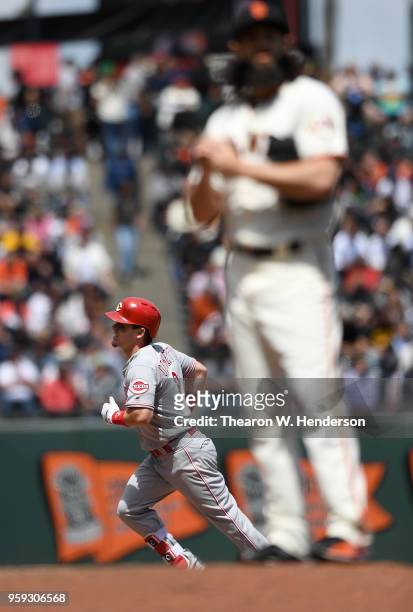 Scooter Gennett of the Cincinnati Reds trots around the bases after hitting a solo home run off of Cory Gearrin of the San Francisco Giants in the...