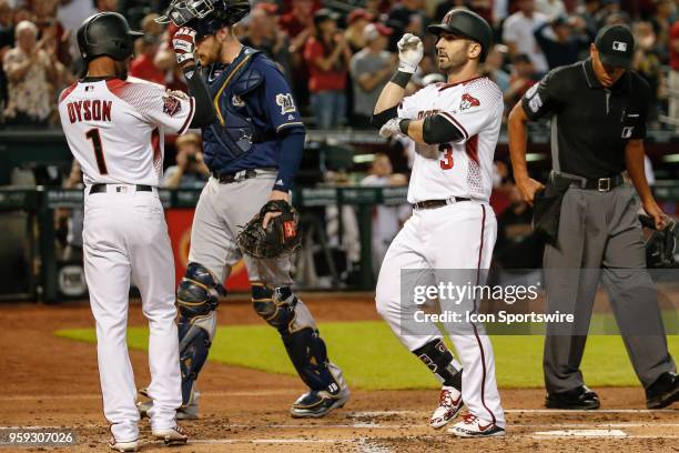 Arizona Diamondbacks third baseman Daniel Descalso celebrates with Arizona Diamondbacks center fielder Jarrod Dyson after hitting a home run during...