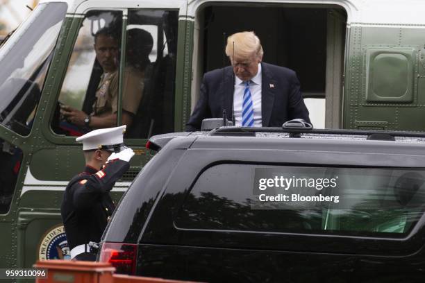 President Donald Trump exits Marine One to visit First Lady Melania Trump at Walter Reed National Military Medical Center in Bethesda, Maryland,...