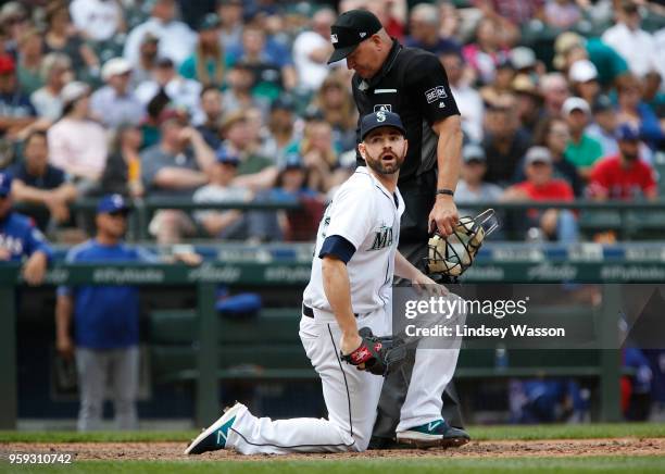 Marc Rzepczynski of the Seattle Mariners reacts after the umpire calls Isiah Kiner-Falefa of the Texas Rangers safe at home in the ninth inning at...