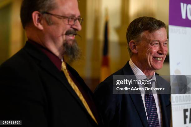 Gov. John Hickenlooper laughs with Senate President Kevin Grantham at the Colorado State Capitol on Wednesday, May 16, 2018. Lawmakers joined Gov....