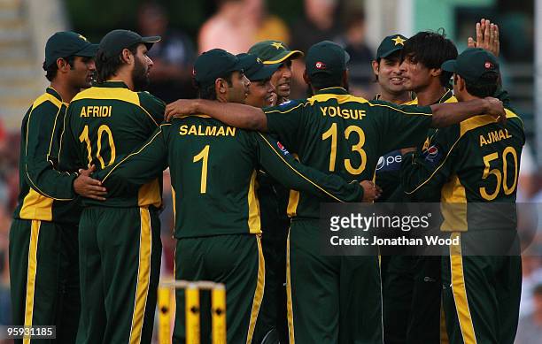 Pakistan celebrate after taking a wicket during the first One Day International match between Australia and Pakistan at The Gabba on January 22, 2010...