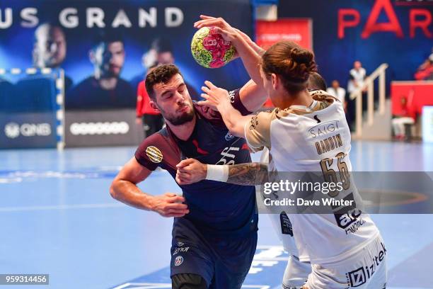 Nedim Remili of PSG and Noah Gaudin of Aix during the Lidl StarLigue match between Paris Saint Germain and Aix at Salle Pierre Coubertin on May 16,...