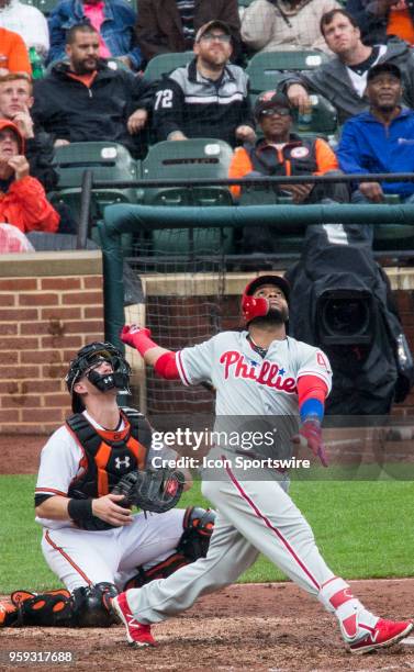 Philadelphia Phillies first baseman Carlos Santana and Baltimore Orioles catcher Chance Sisco look up for the ball during a MLB game between the...