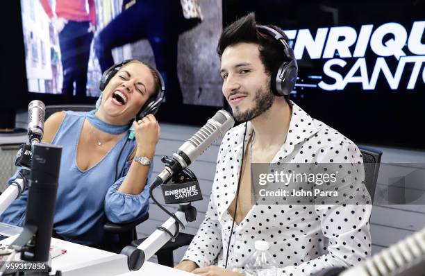 Gina Ulmos and Sebastian Yatra are seen at "The Enrique Santos Show" at I Heart Latino Studios on May 16, 2018 in Miramar, Florida.