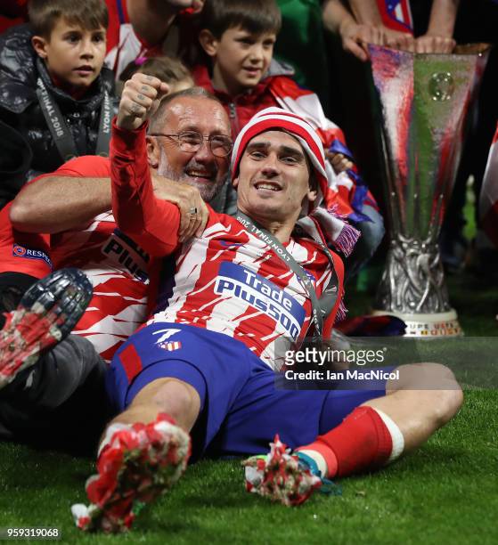 Antoine Griezmann of Athletico Madrid poses beside the trophy during the UEFA Europa League Final between Olympique de Marseille and Club Atletico de...