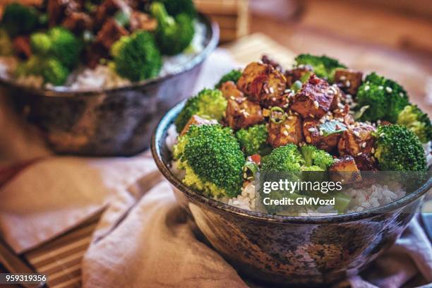 roasted tofu with soy sauce, broccoli and rice - sesame oil stock pictures, royalty-free photos & images