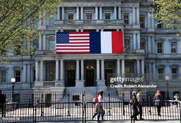 Tourists walk in front of the Eisenhower Executive Office Building next to the White House on Pennsylnavia Avenue in Washington, D.C. The American...