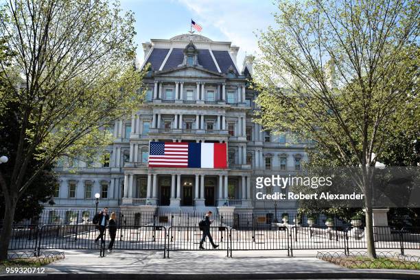 Tourists walk in front of the Eisenhower Executive Office Building next to the White House on Pennsylnavia Avenue in Washington, D.C. The American...