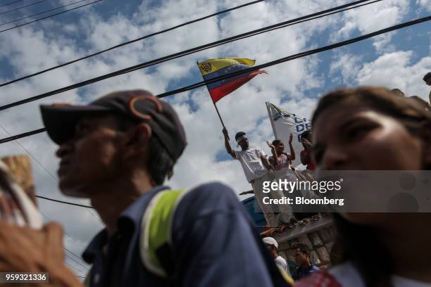 An attendee waves a flag during the closing campaign rally for Evangelical pastor Javier Bertucci, presidential candidate for the Esperanza Por El...