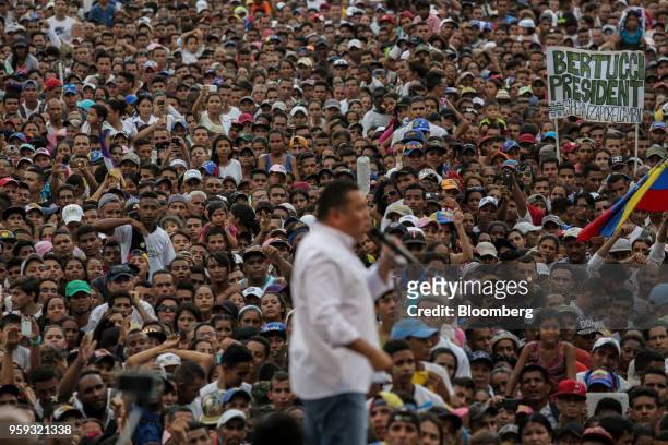 Attendees listen as Evangelical pastor Javier Bertucci, presidential candidate for the Esperanza Por El Cambio Party, speaks during his closing...