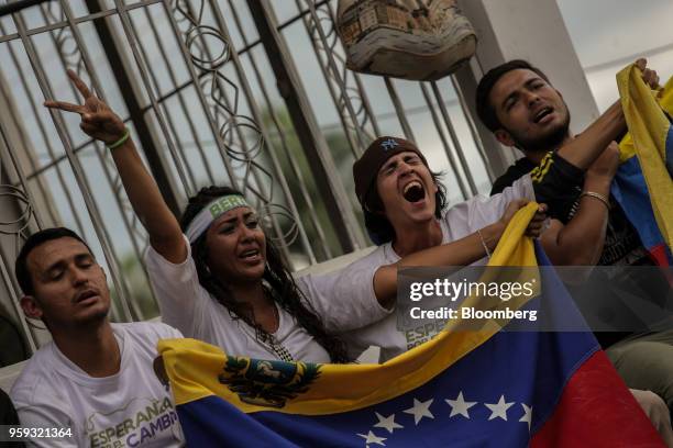 Attendees hold flags and cheer during the closing campaign rally for Evangelical pastor Javier Bertucci, presidential candidate for the Esperanza Por...