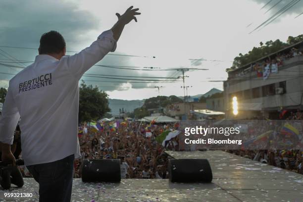 Evangelical pastor Javier Bertucci, presidential candidate for the Esperanza Por El Cambio Party, waves as he arrives to speak during his closing...