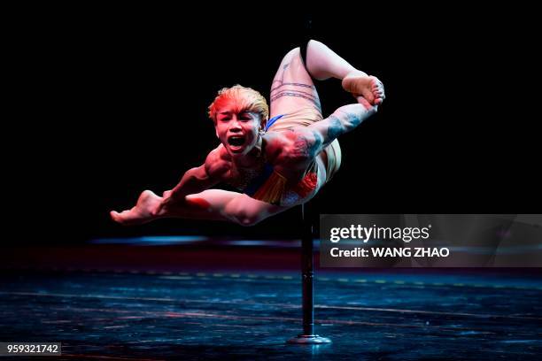 This picture taken on May 16 shows China's Ke Hong competing during the finals of the 2018 World Pole Dance Championships in Tianjin.