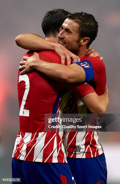 Gabi of Atletico de Madrid celebrates after scoring his sides third goal with his teammate Diego Roberto Godin during the UEFA Europa League Final...