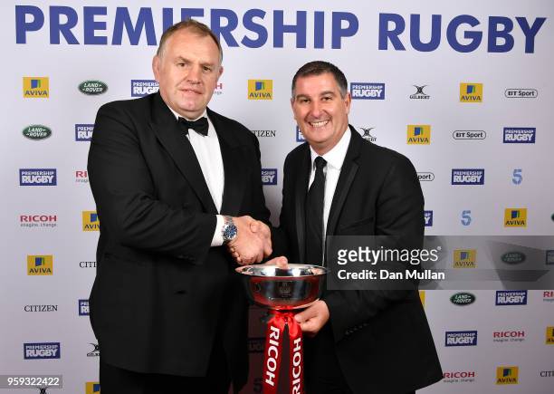 Dean Richards of Newcastle Falcons receives the Ricoh Director of Rugby of the Season award from Chas Moloney of Ricoh during the Premiership Rugby...