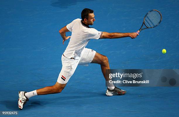 Ivo Karlovic of Croatia plays a backhand in his third round match against Ivan Ljubicic of Croatia during day five of the 2010 Australian Open at...