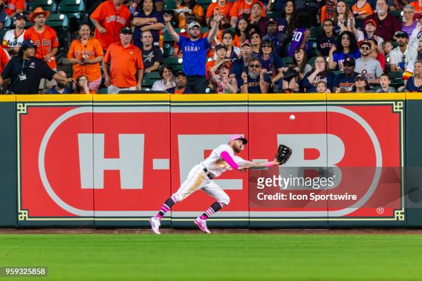 Houston Astros right fielder Derek Fisher makes a catch for the out in the eighth inning during an MLB baseball game between the Houston Astros and...