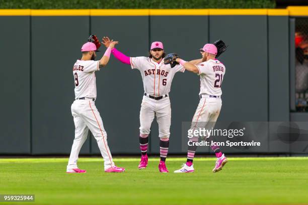 Houston Astros left fielder Marwin Gonzalez , Houston Astros center fielder Jake Marisnick and Houston Astros right fielder Derek Fisher celebrate at...
