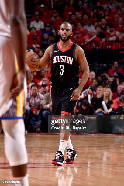 Chris Paul of the Houston Rockets handles the ball against the Golden State Warriors in Game Two of the Western Conference Finals of the 2018 NBA...