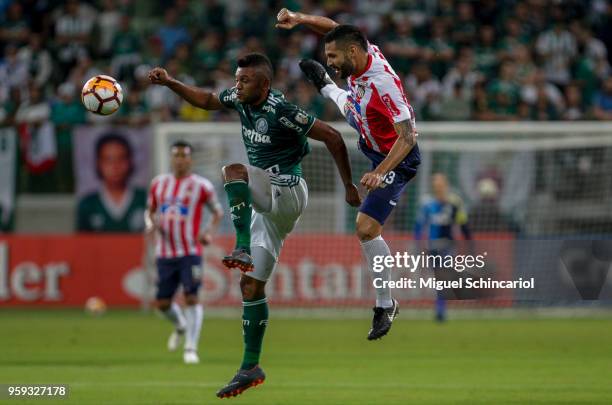 Miguel Borja of Palmeiras of Brazil vies for the ball with Jonathan Avila of Junior Barranquilla of Colombia during the match for the Copa CONMEBOL...