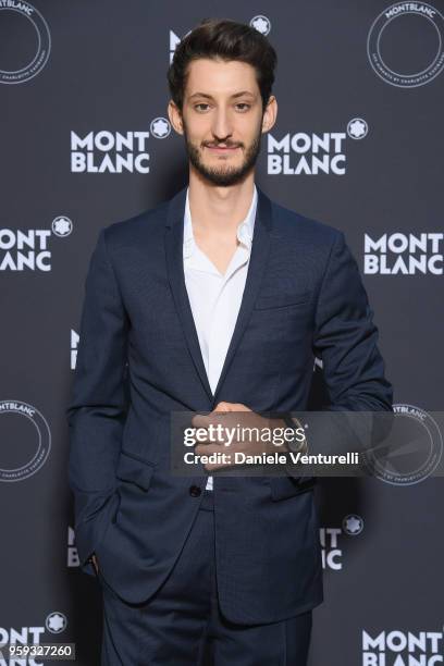 Pierre Niney attends the Montblanc dinner hosted by Charlotte Casiraghi for the collection launch 'Les Aimants at Villa La Favorite on May 16, 2018...