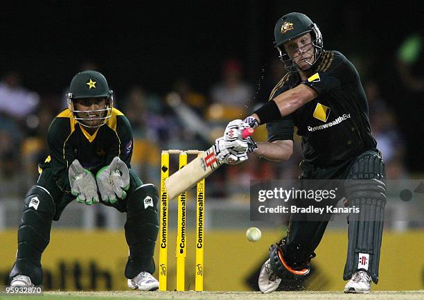 Cameron White of Australia hits the ball over the boundary for his second of three sixes in a row during the first One Day International match...