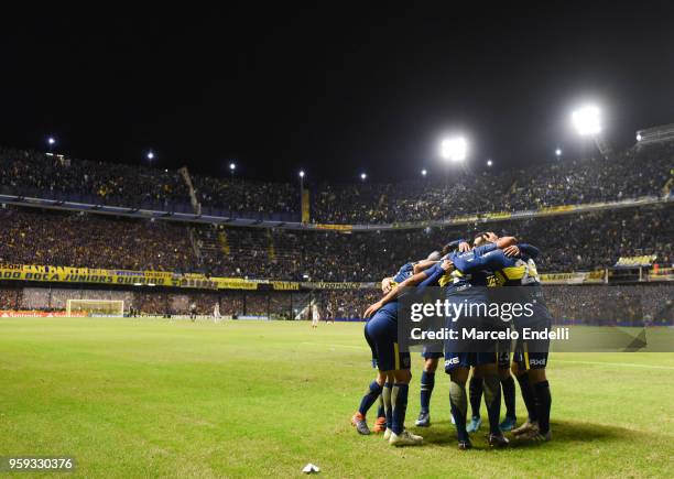 Ramon Abila of Boca Juniors celebrates with teammates after scoring the third goal of his team during a match between Boca Juniors and Alianza Lima...