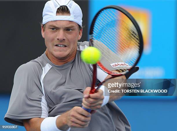 Kazakh tennis player Evgeny Korolev plays a backhand return during his men's singles match against Chilean opponent Fernando Gonzalez on the fifth...