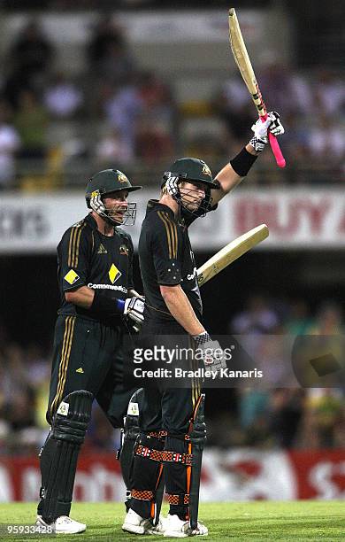 Cameron White of Australia celebrates scoring his century during the first One Day International match between Australia and Pakistan at The Gabba on...