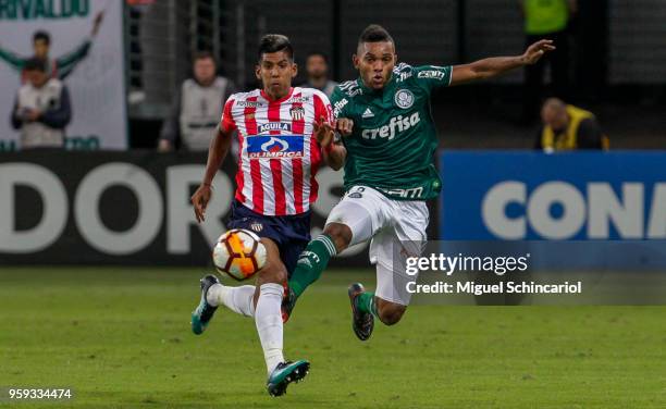 Miguel Borja of Palmeiras of Brazil vies for the ball with Davi Murillo of Junior Barranquilla of Colombia during the match for the Copa CONMEBOL...