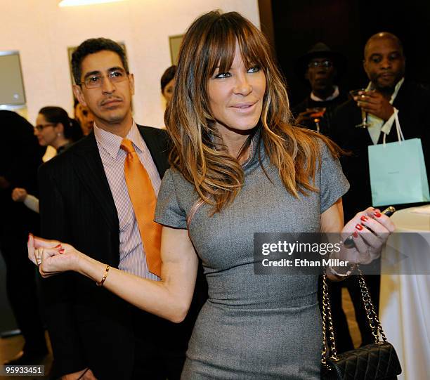 Choreographer and Pussycat Dolls creator Robin Antin watches a performance by singer/songwriter Matt Goss during a grand opening cocktail party at...