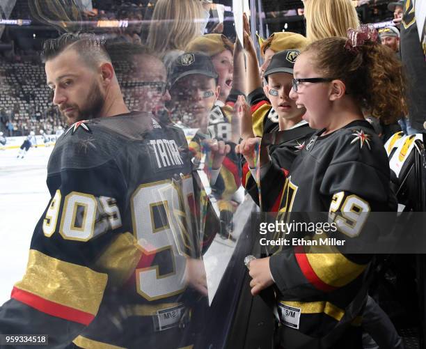 Miah Downs 11, of Nevada, reacts as Tomas Tatar of the Vegas Golden Knights stands in front of her during warmups before Game Three of the Western...