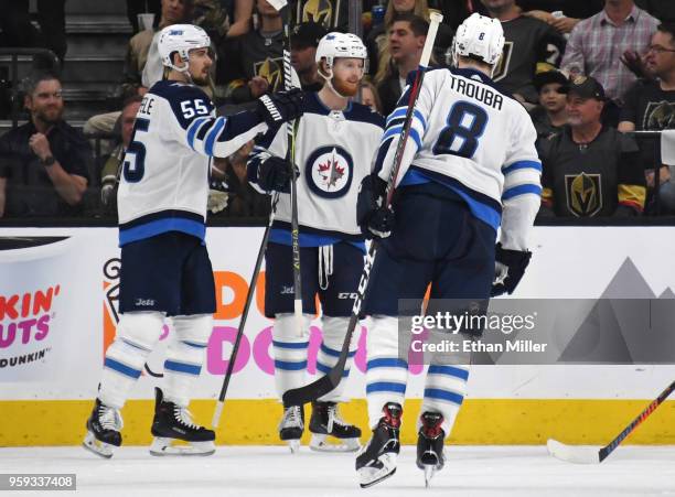 Mark Scheifele of the Winnipeg Jets is congratulated by his teammates after scoring a second-period goal against the Vegas Golden Knights in Game...