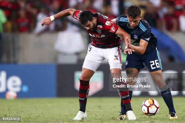 Henrique Dourado of Flamengo struggles for the ball with a MejÃ­a of Emelec during a Group Stage match between Flamengo and Emelec as part of Copa...