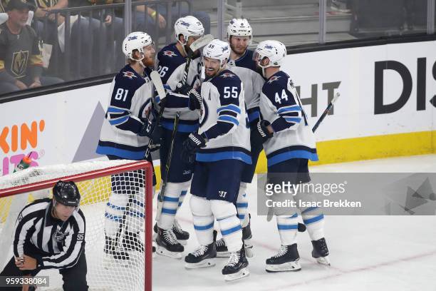 Mark Scheifele of the Winnipeg Jets is congratulated by his teammates after scoring a second-period goal against the Vegas Golden Knights in Game...