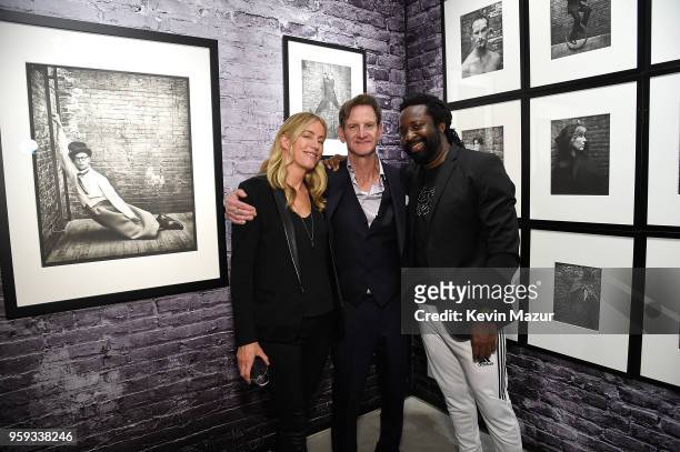 Ruth Levy, Mark Seliger and Marlon James pose during a private viewing of Mark Seliger "Photographs" at Chase Contemporary on May 16, 2018 in New...