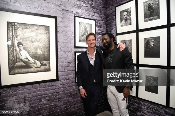 Mark Seliger and Marlon James pose during a private viewing of Mark Seliger "Photographs" at Chase Contemporary on May 16, 2018 in New York City.
