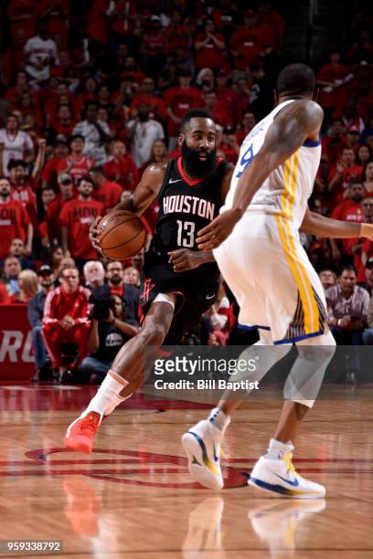 James Harden of the Houston Rockets handles the ball against the Golden State Warriors in Game Two of the Western Conference Finals of the 2018 NBA...