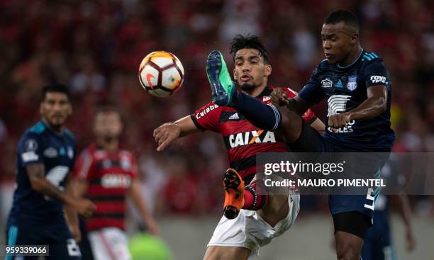 Brazil's Flamengo team player Lucas Paqueta vies for the ball with Ecuador's Emelec player Dixon Arroyo , during the Copa Libertadores 2018 football...