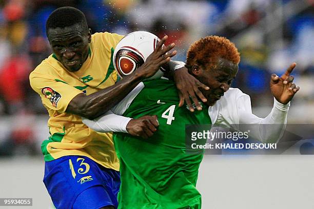 Musonda Joseph of Zambia vies for the ball with Mbanangoye Zita of Gabon during their group 'D' stage match at the African Cup of Nations CAN2010 at...