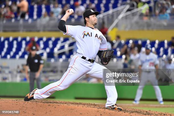 Junichi Tazawa of the Miami Marlins throws a pitch during the sixth inning against the Los Angeles Dodgers at Marlins Park on May 16, 2018 in Miami,...