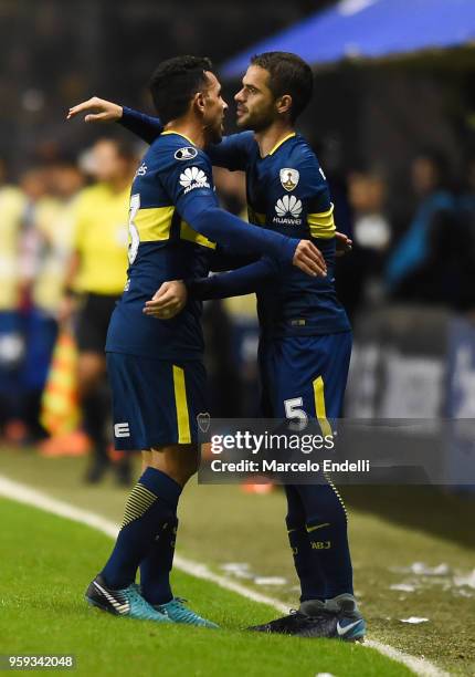 Carlos Tevez of Boca Juniors hugs Fernando Gago of Boca Juniors during a match between Boca Juniors and Alianza Lima at Alberto J. Armando Stadium on...